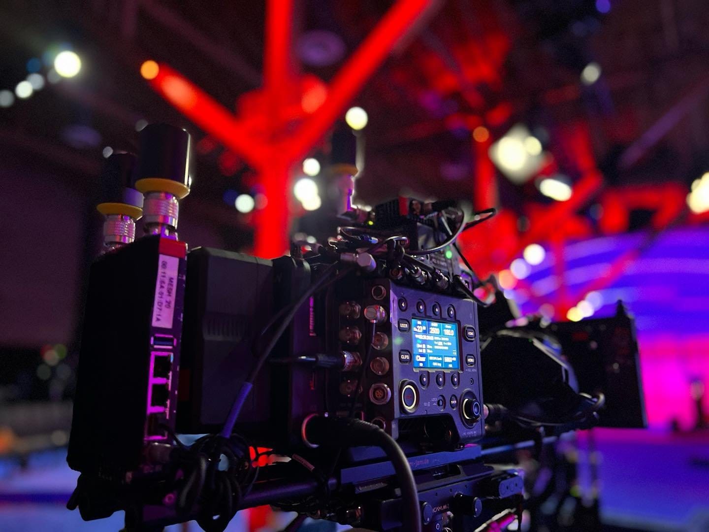 CineVue-equipped cinema camera operating under red stage lighting
