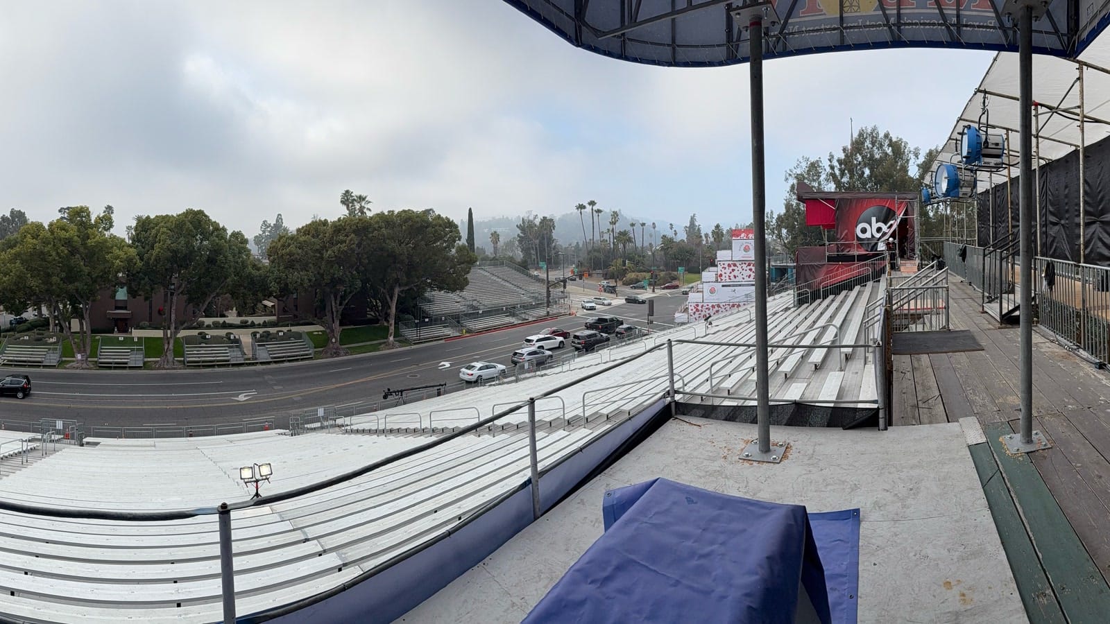 Wide view from empty Rose Parade grandstands across the parade route in Pasadena before event day