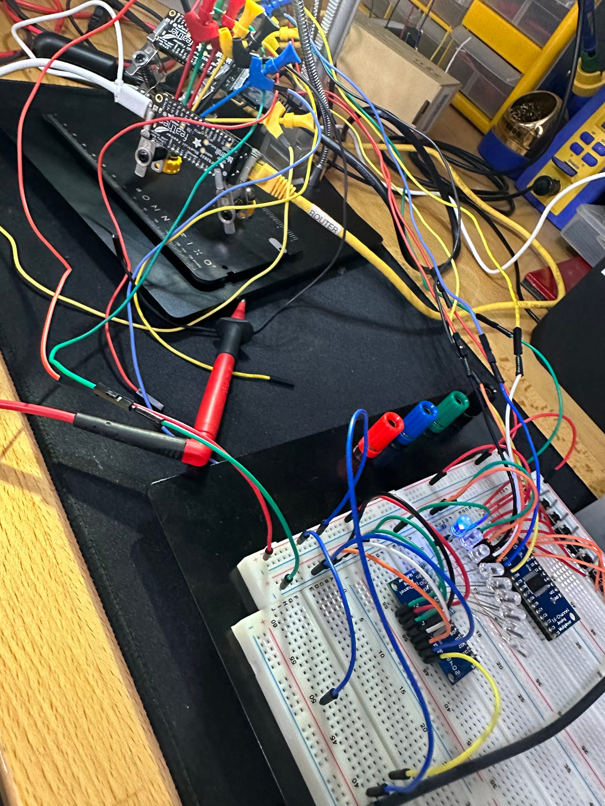 Full workbench view of the connected prototype boards and breadboard wiring