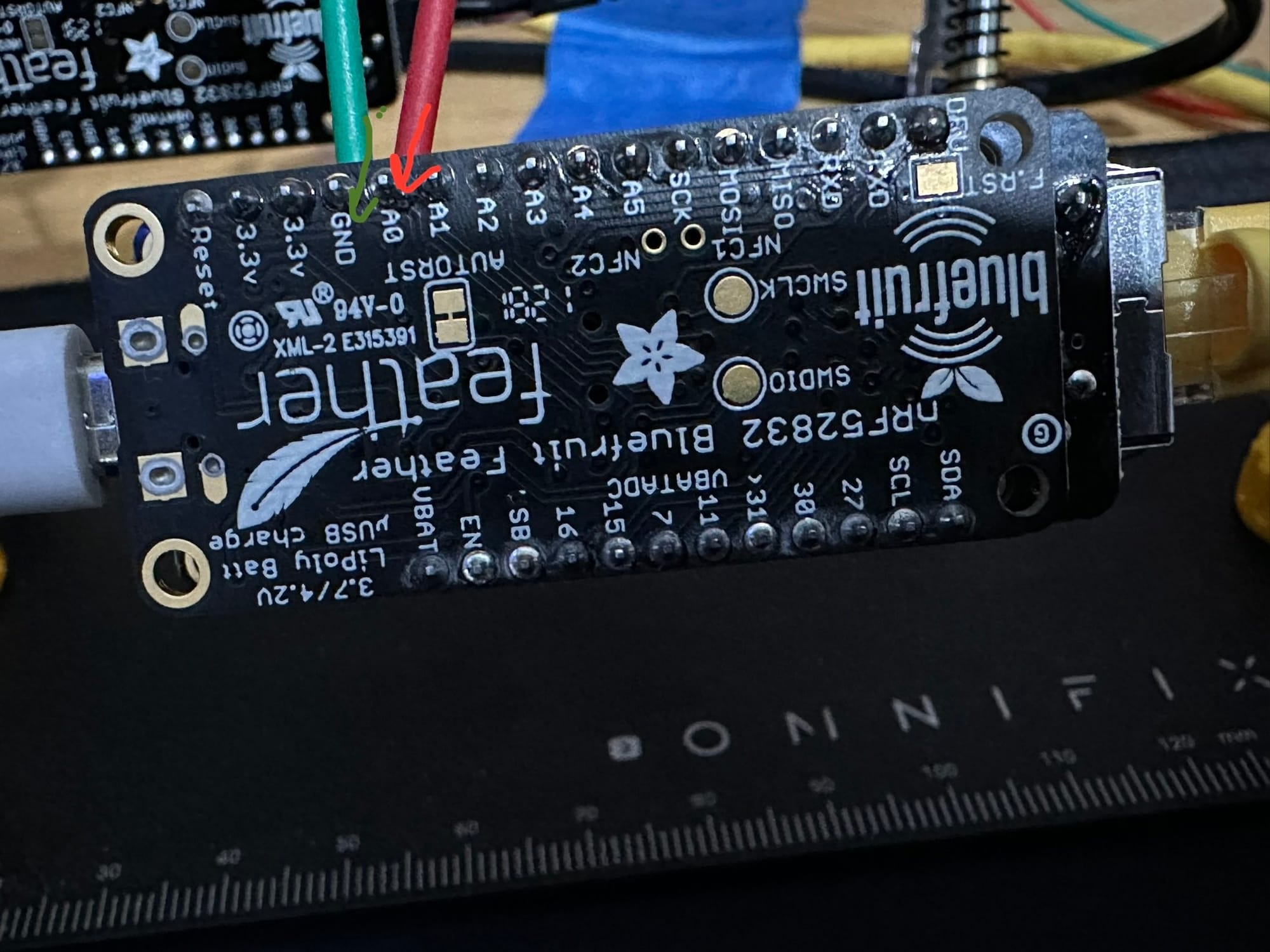 Close view of the compact microcontroller board used in the tally-light prototype