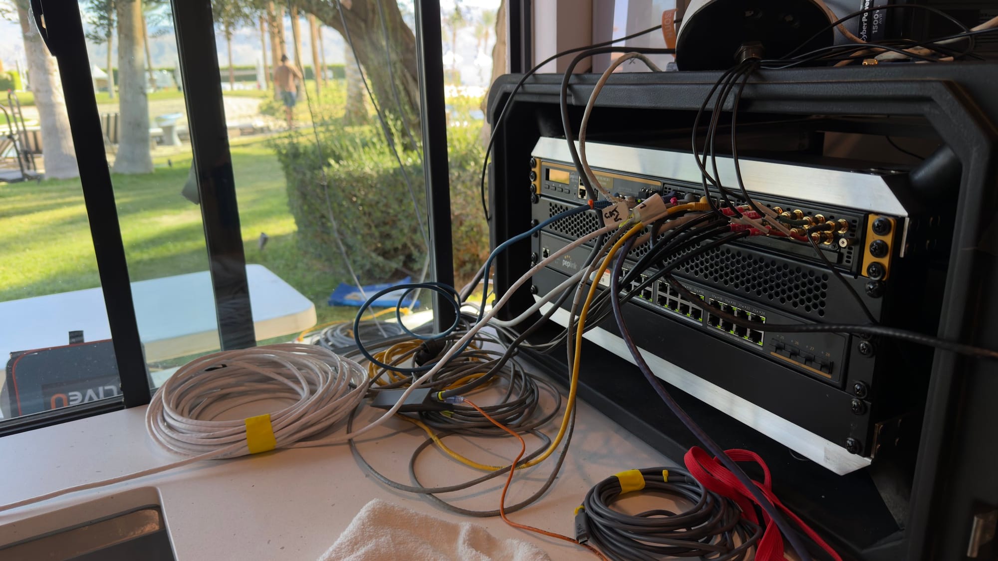 Temporary network and transmission equipment connected beside a window