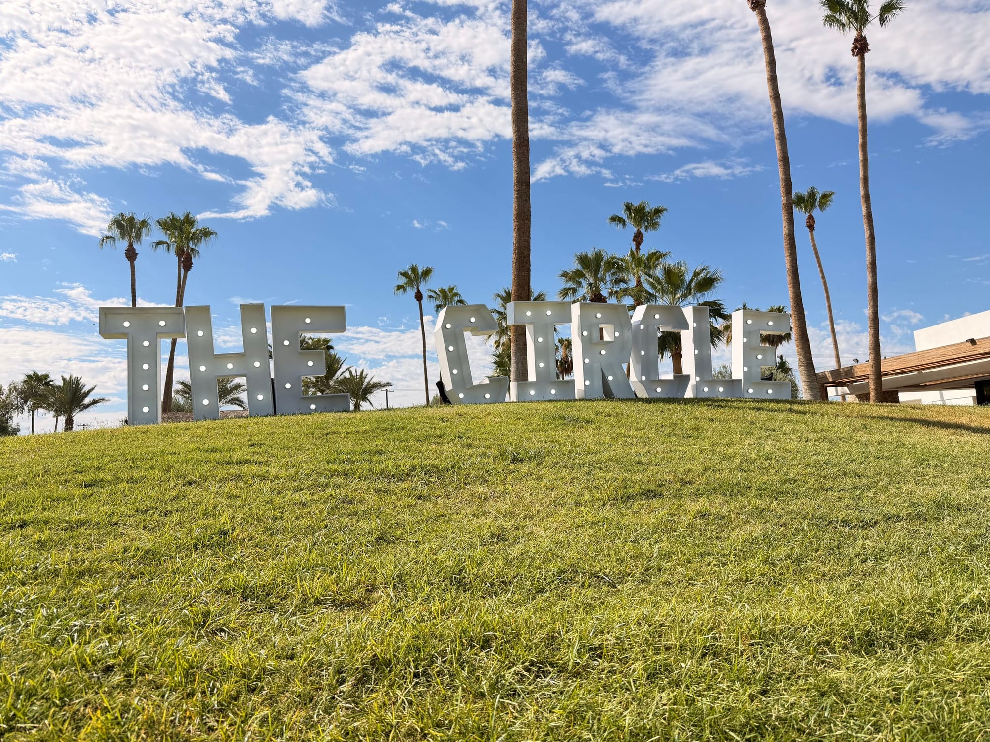 The Circle event sign installed on the estate lawn