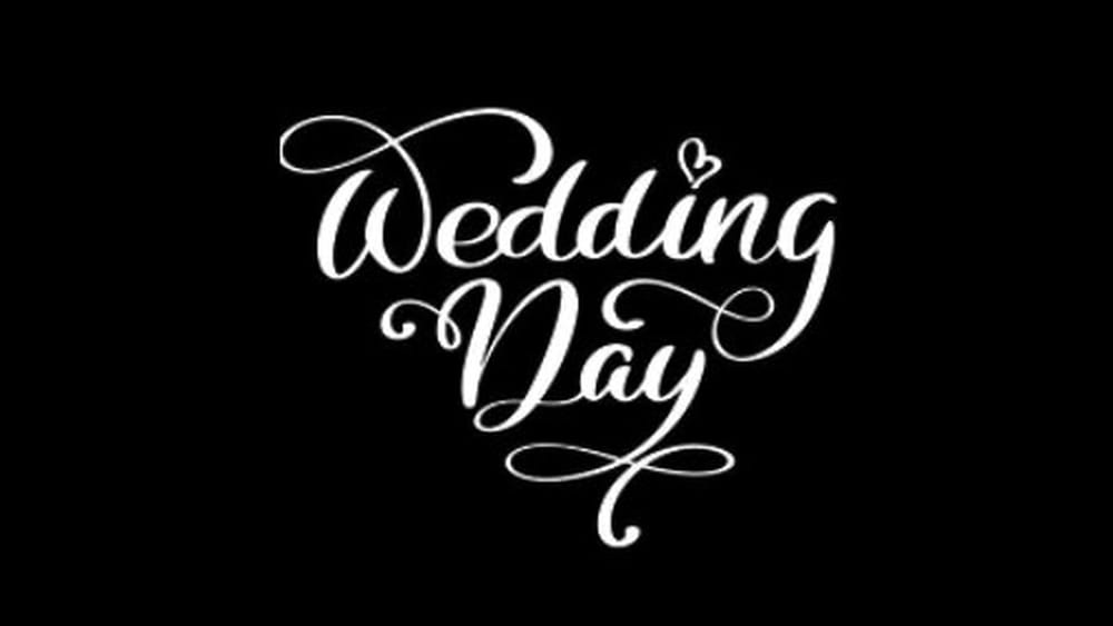 White script text reading Wedding Day on a black background