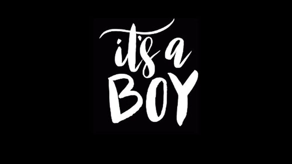 White handwritten text reading It's a Boy on a black background