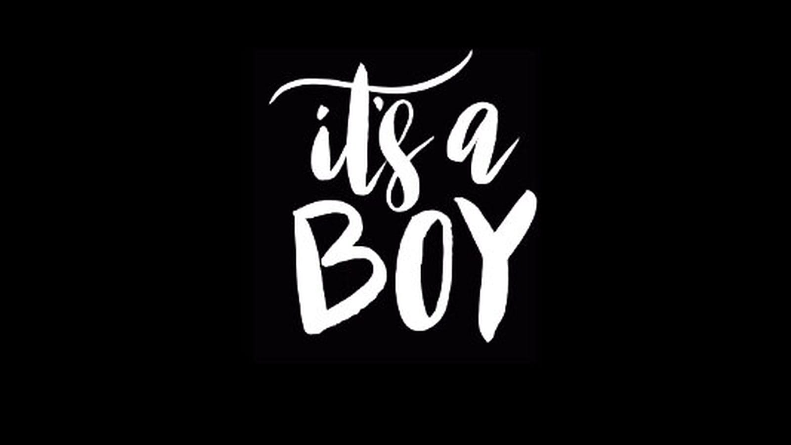 White handwritten text reading It's a Boy on a black background